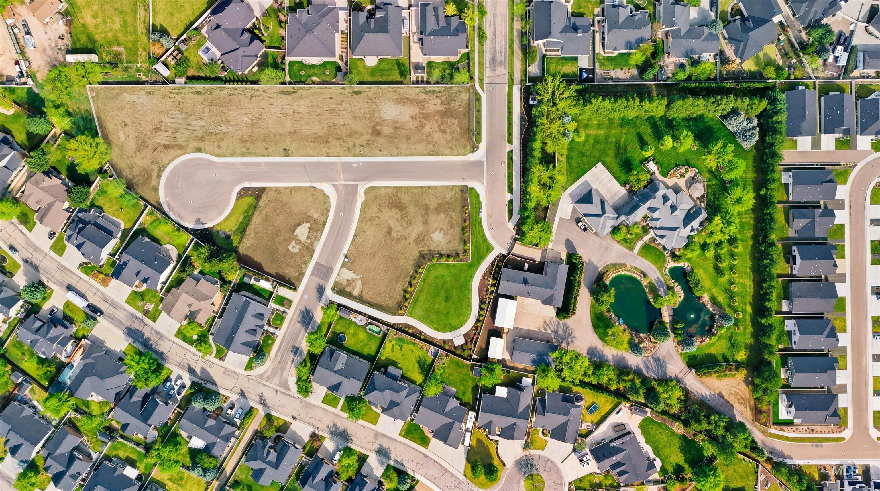 Aerial view of residential area with property boundaries highlighted