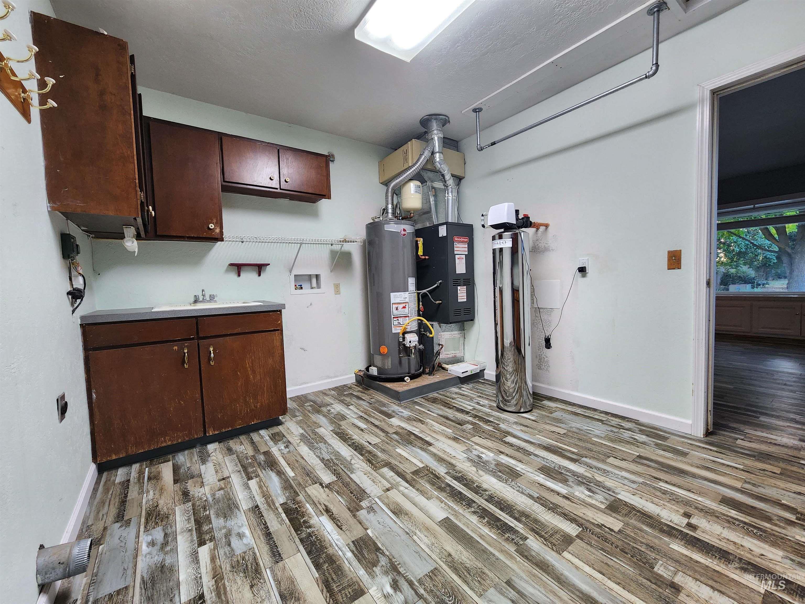 Utilities with gas water heater and heating unit