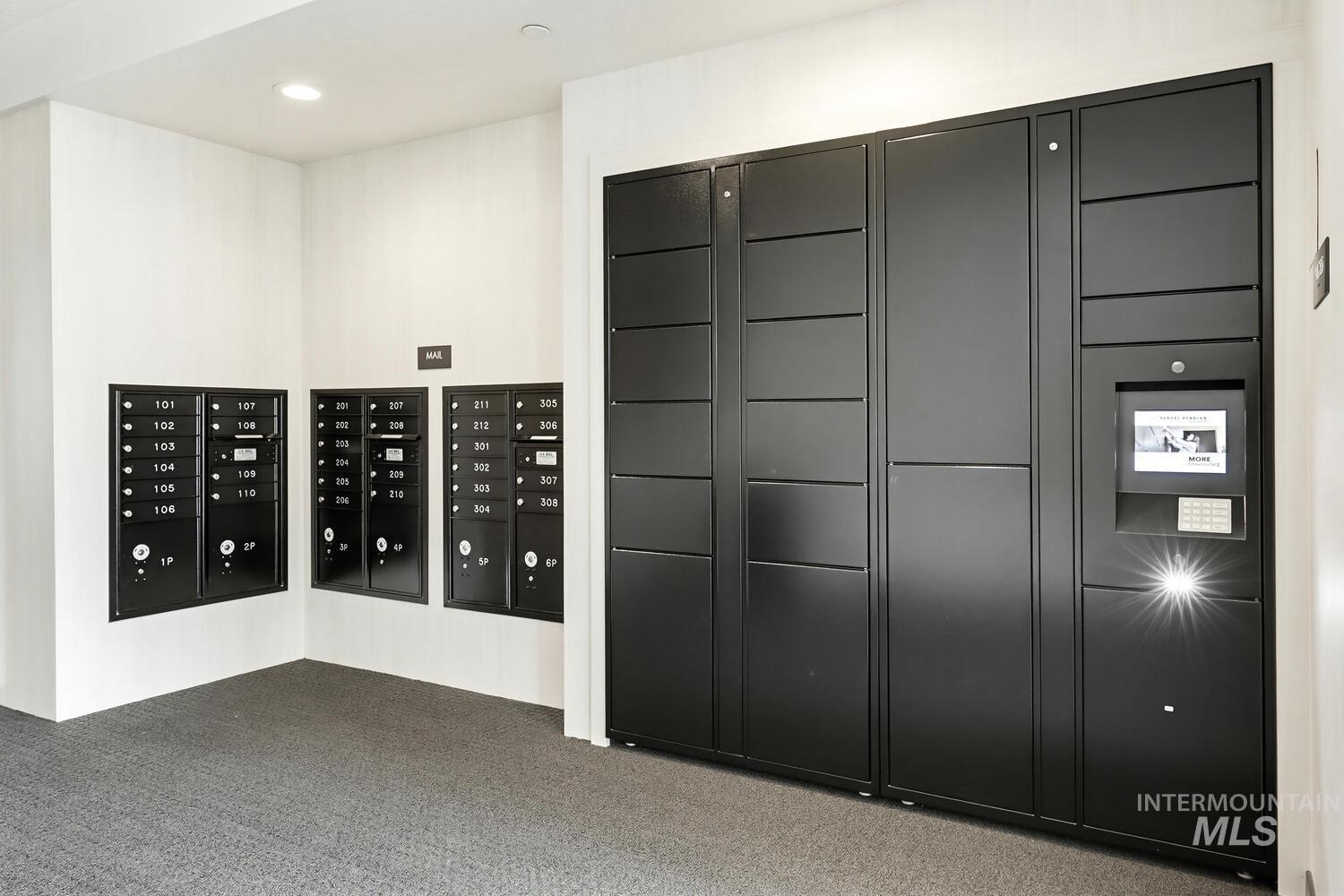 View of property's community featuring mail area and recessed lighting