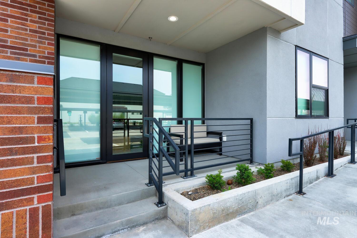 Entrance to property featuring stucco siding