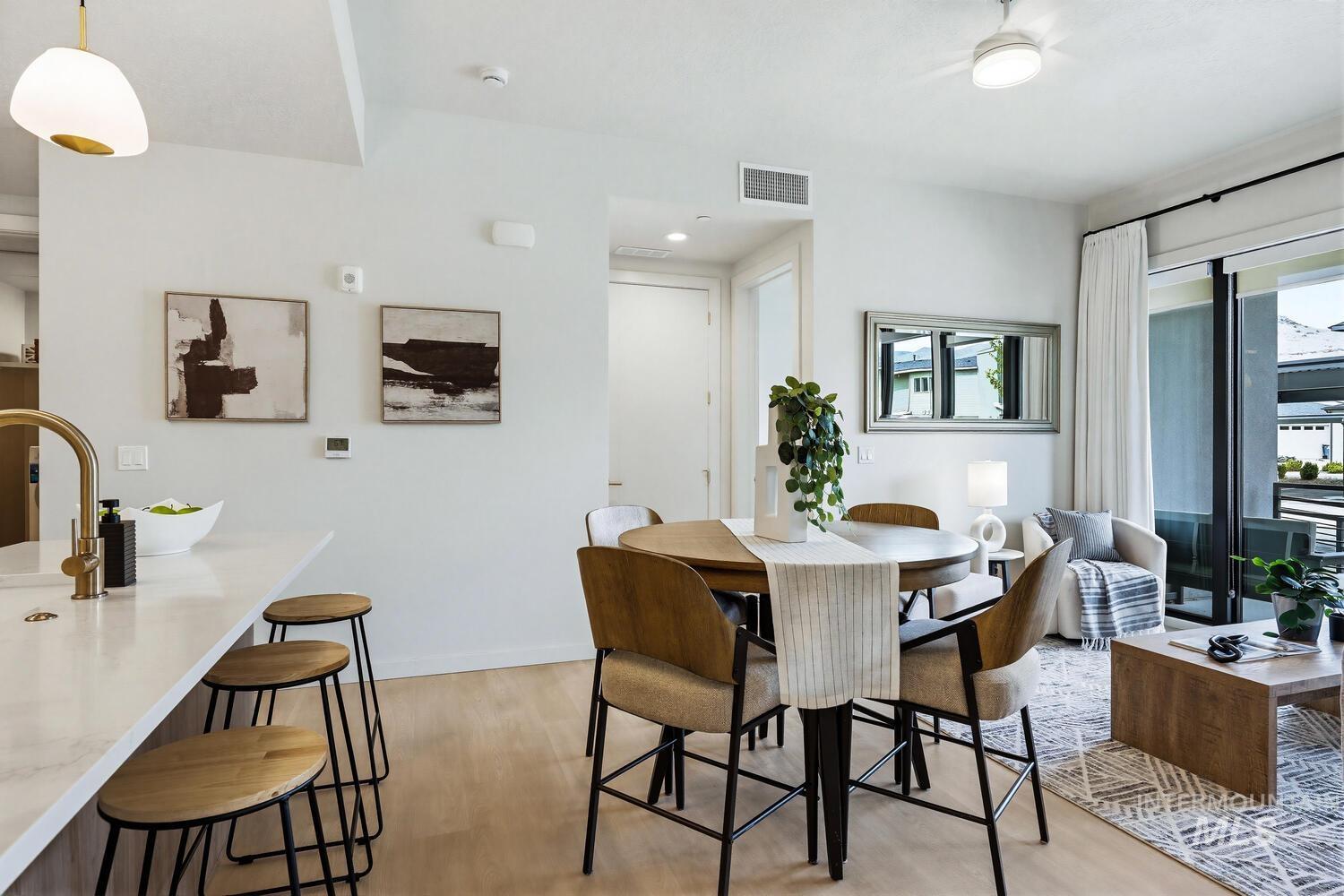 Dining area with light wood-type flooring and recessed lighting