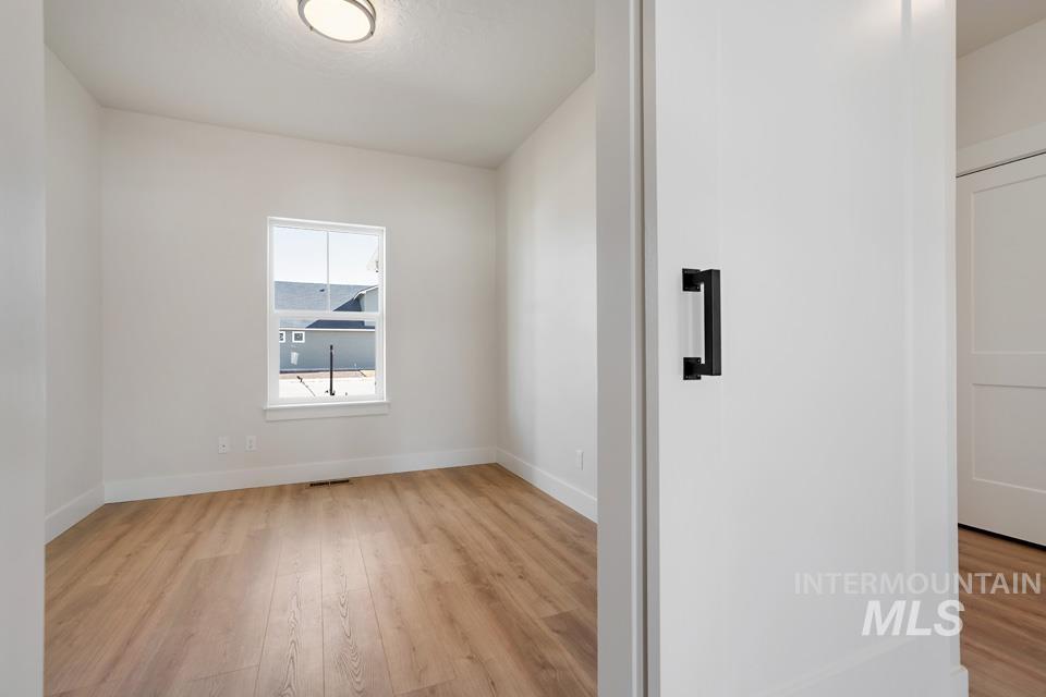 Spare room featuring light wood finished floors