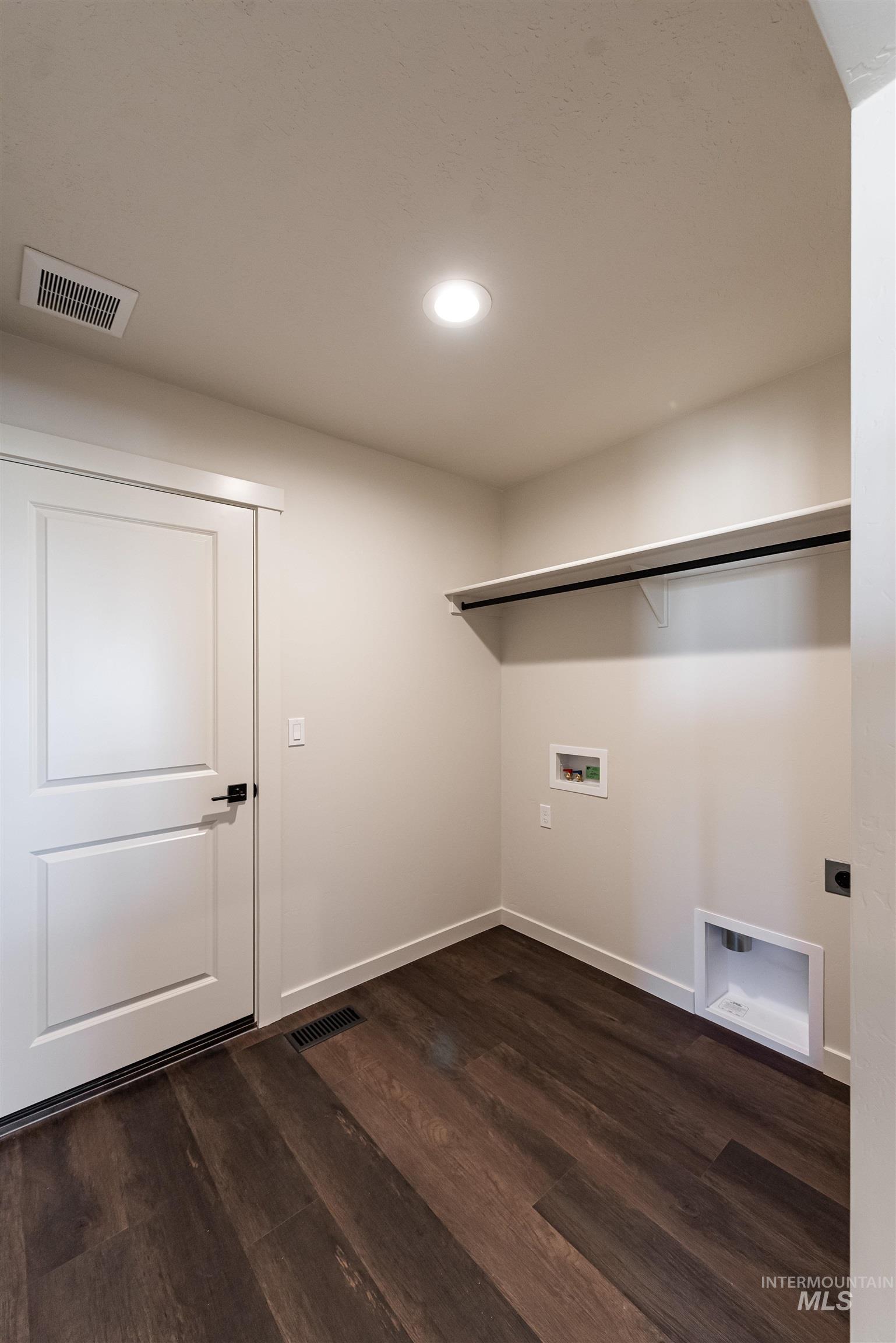 Laundry area featuring washer hookup, dark wood-style flooring, and recessed lighting