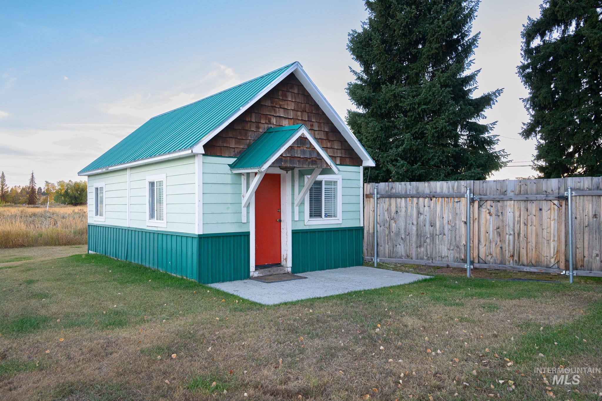 View of outdoor structure featuring a fenced backyard