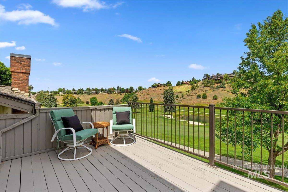 Spacious outdoor deck with composite decking and a metal railing