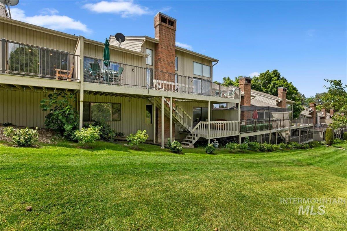 Expansive green lawn backing to multi-level private decks