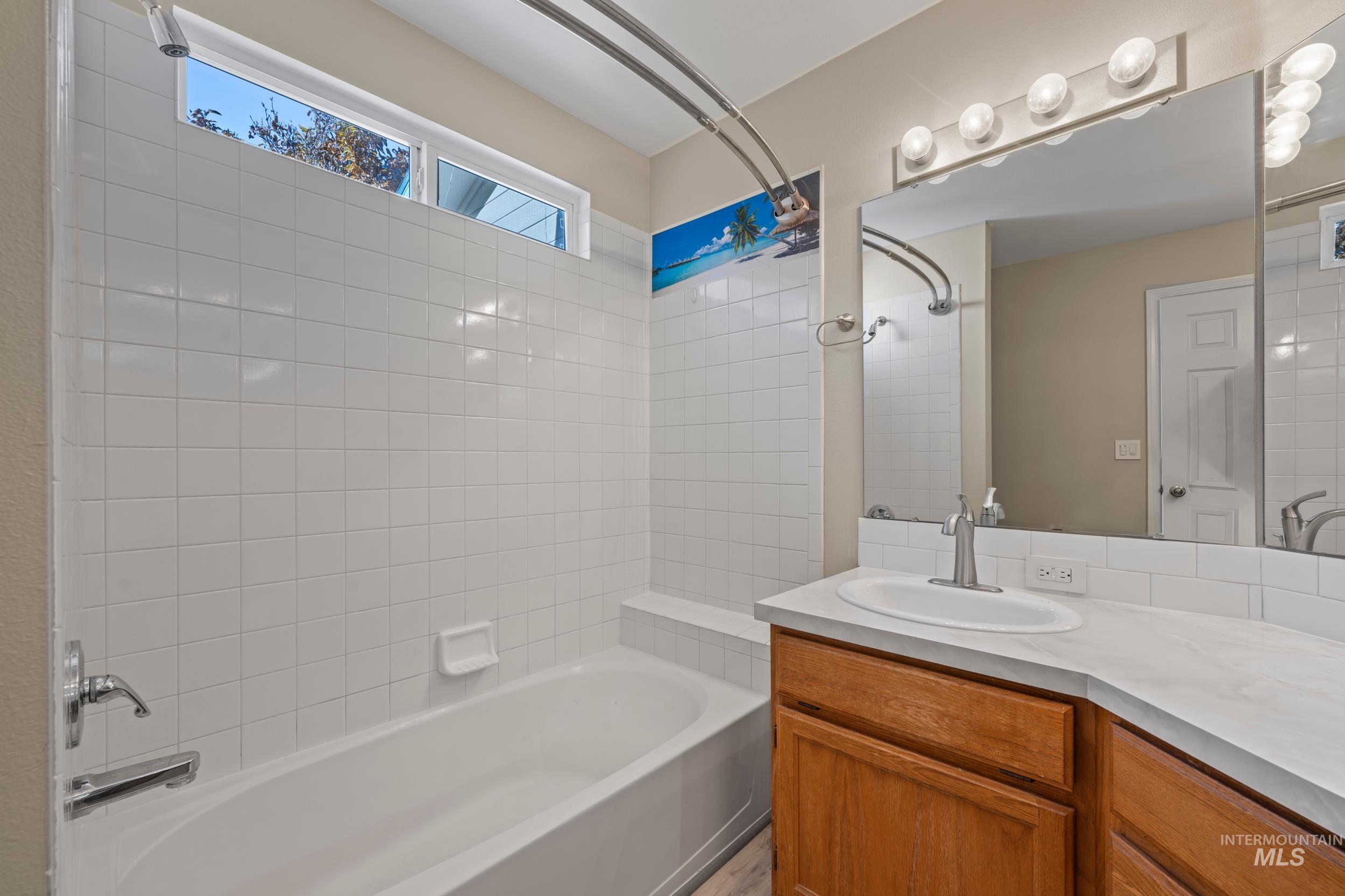 Full bath with shower / washtub combination and vanity