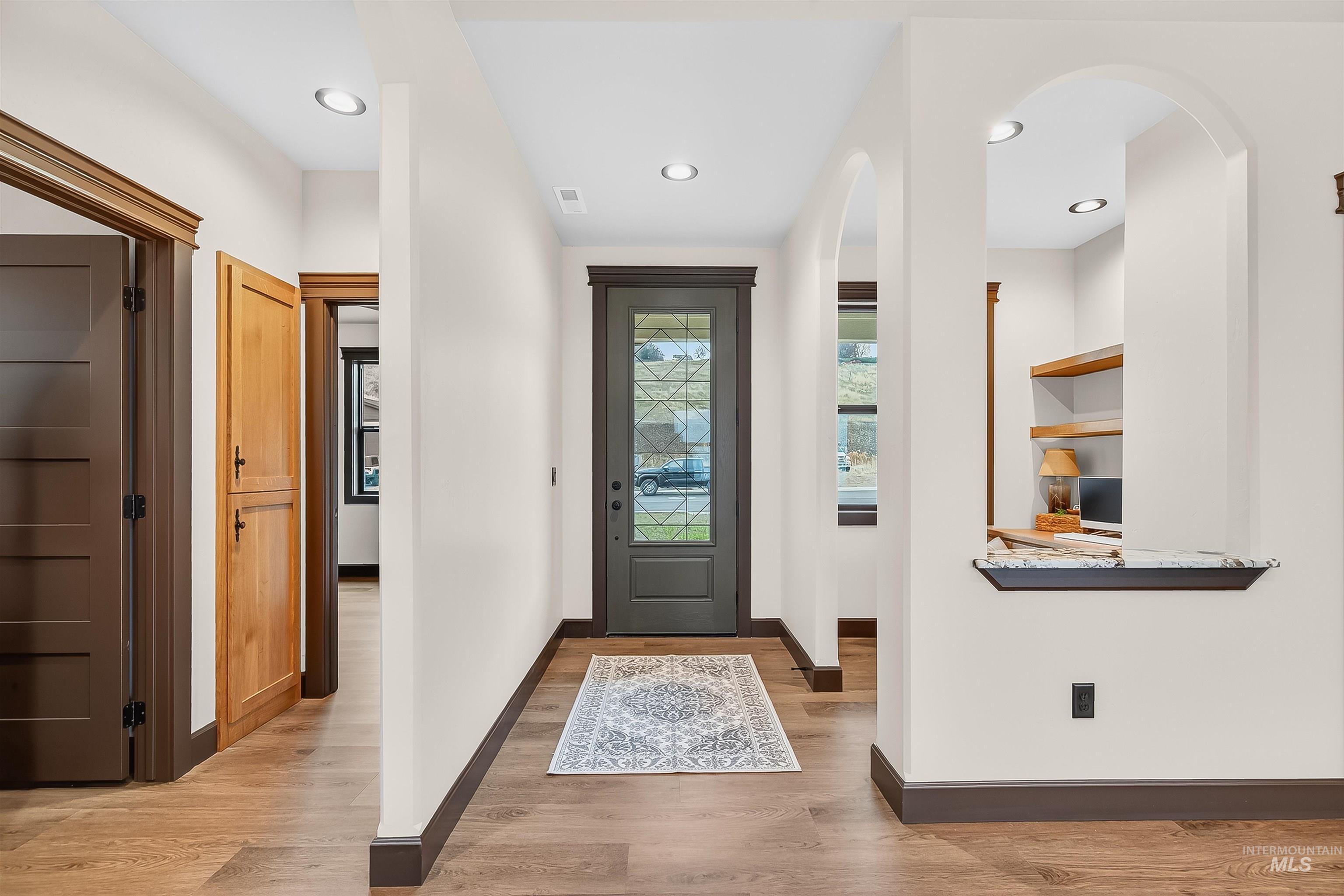 Entrance foyer featuring light wood-type flooring and recessed lighting