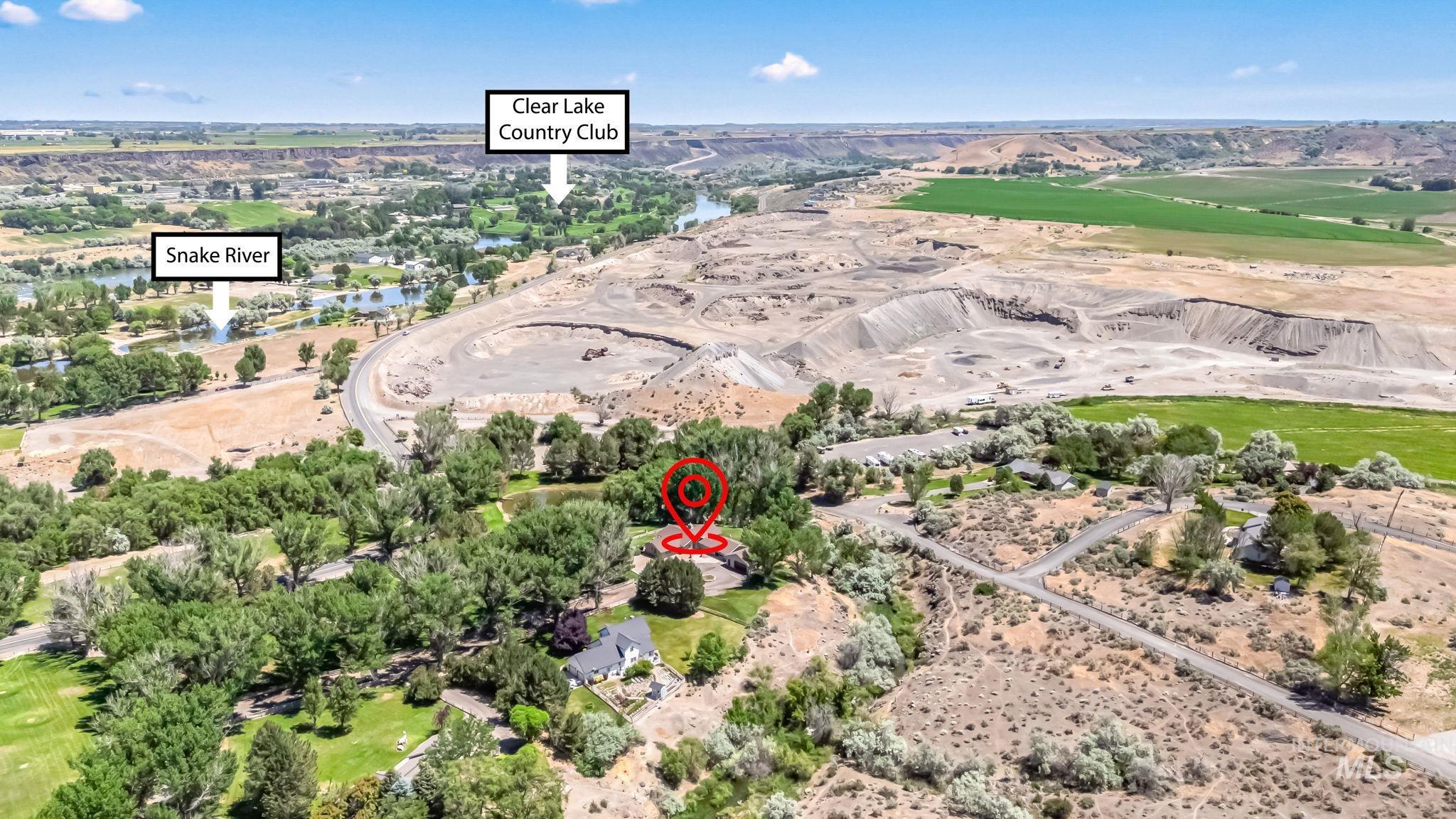Aerial overview of property's location featuring a golf club