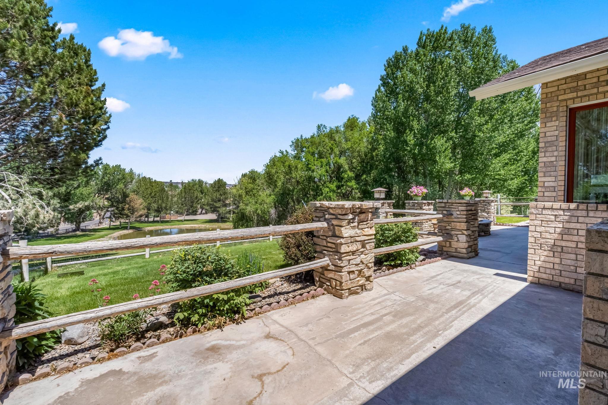 View of patio / terrace with a water view