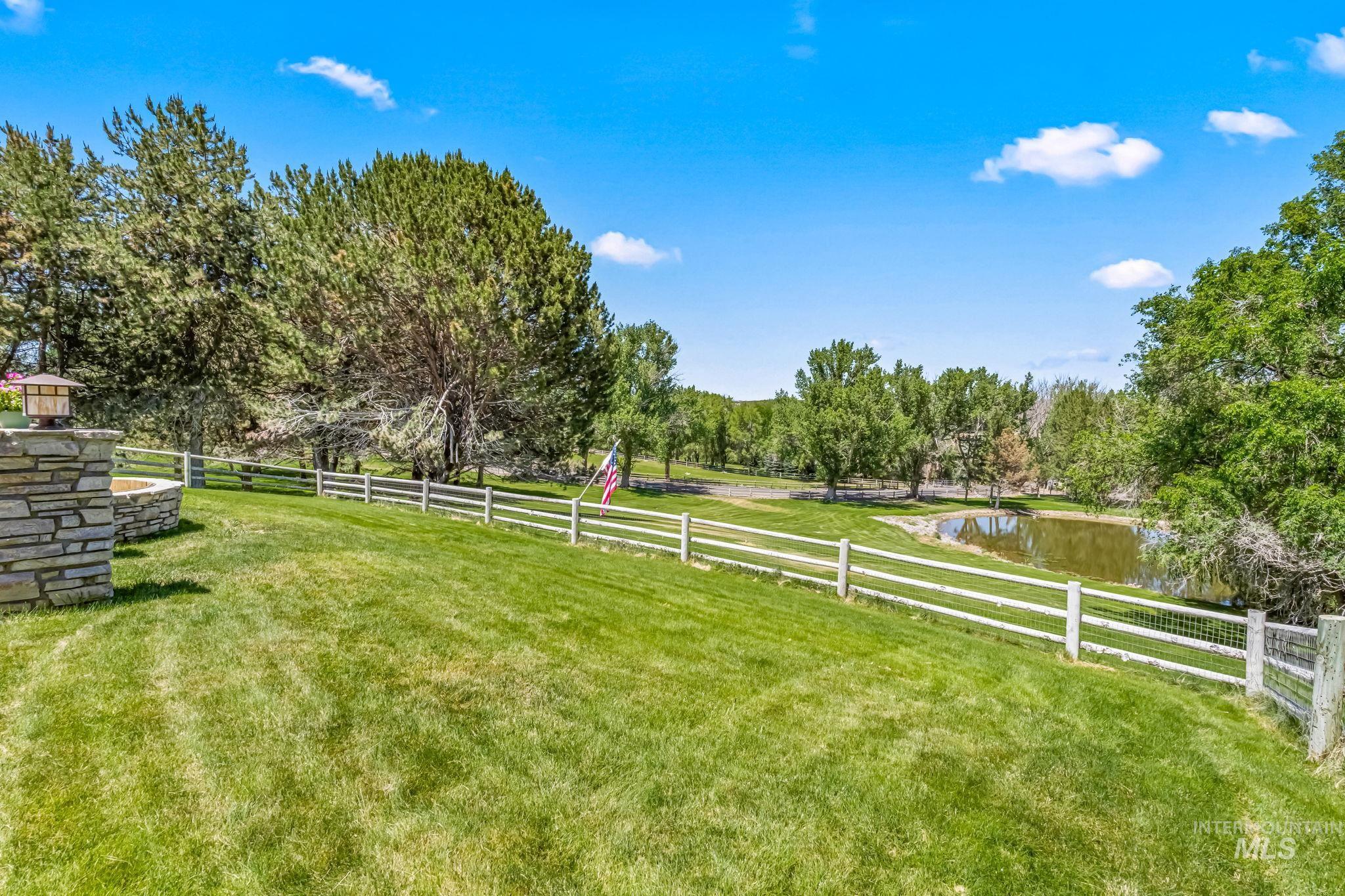 View of yard featuring a rural view and a water view