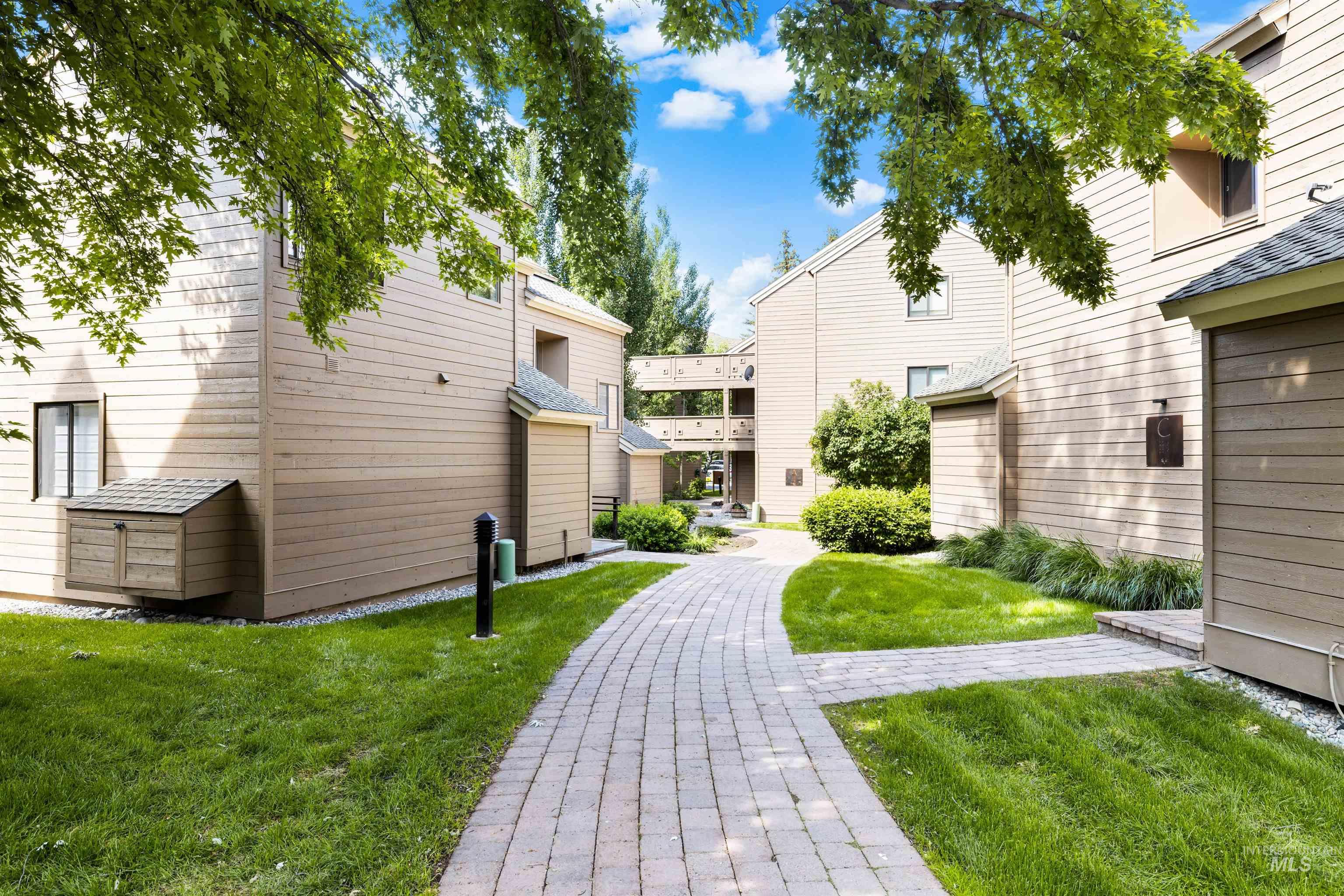 View of property's community featuring a lawn