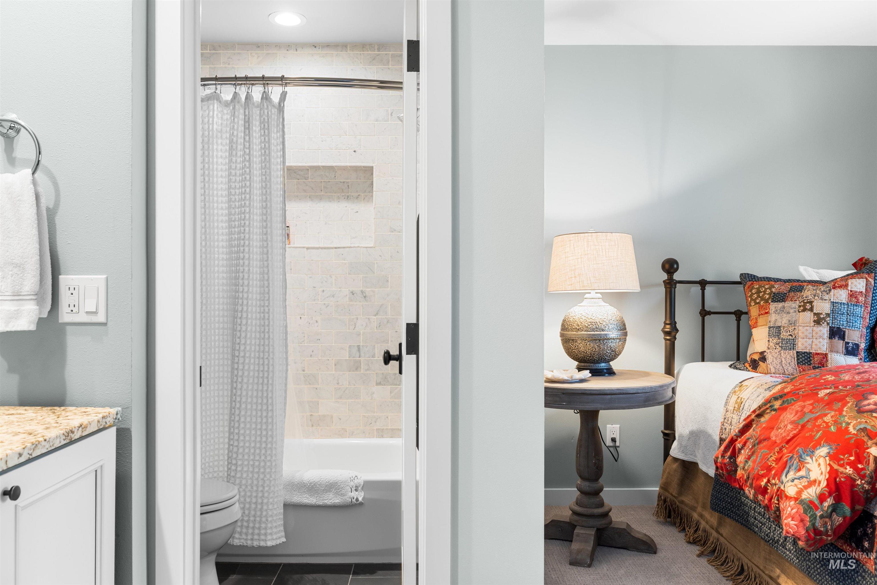 Bedroom featuring ensuite bath