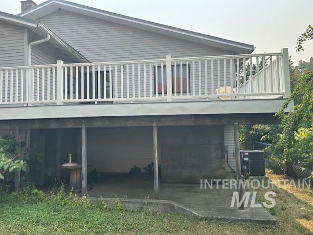 Rear view of property with a deck