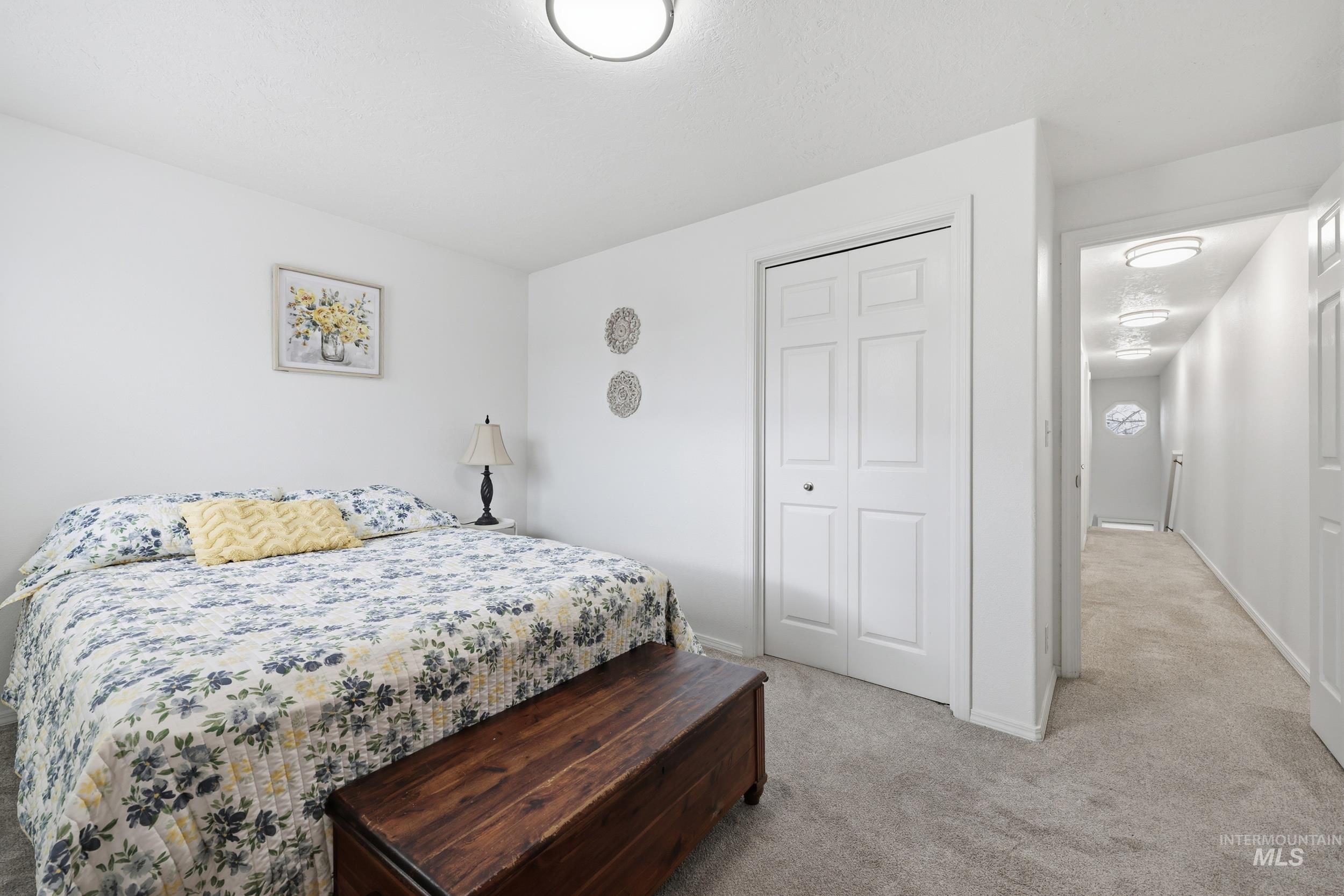 Bedroom with carpet floors and a closet