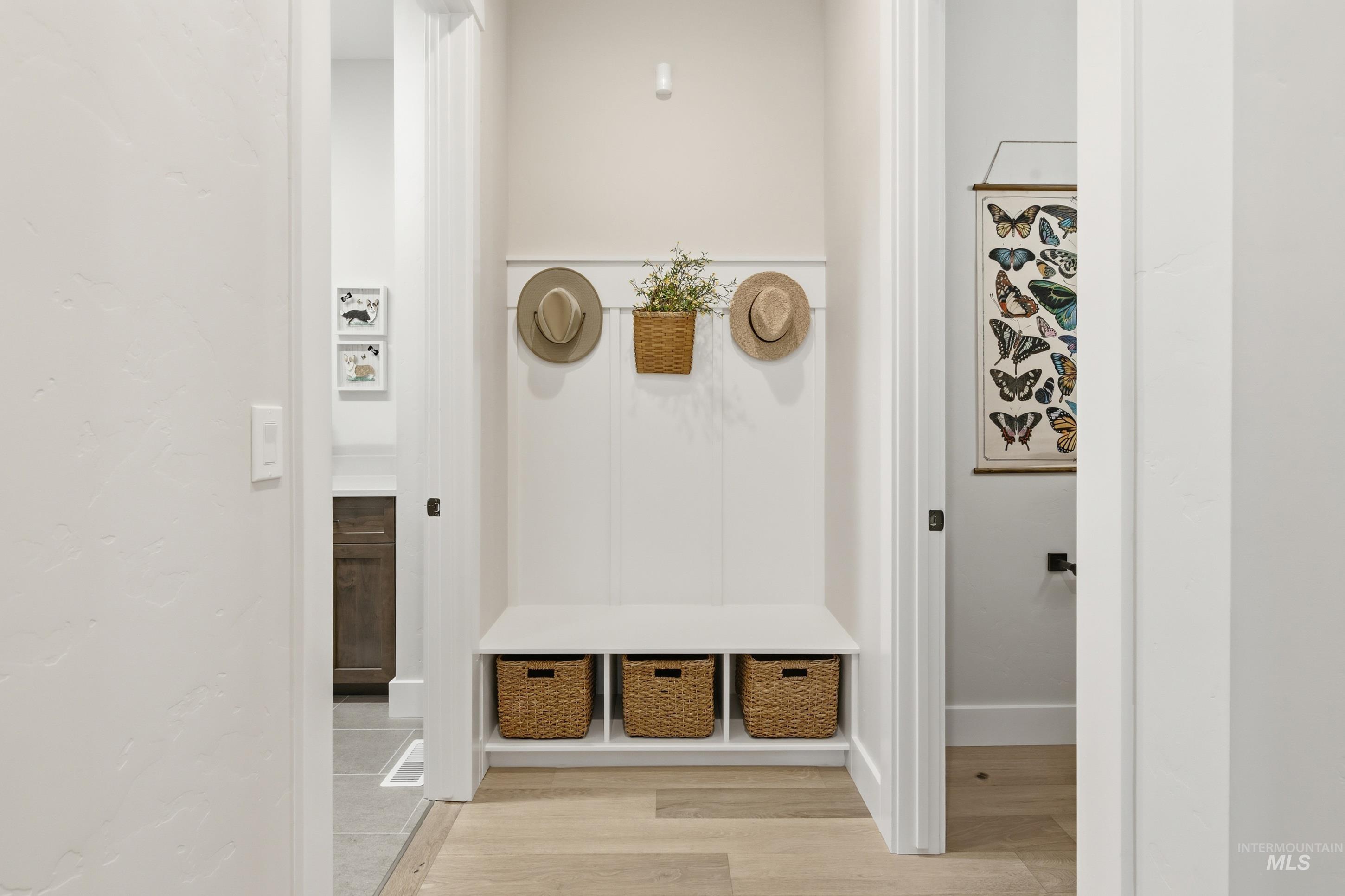 Mudroom featuring light wood-type flooring