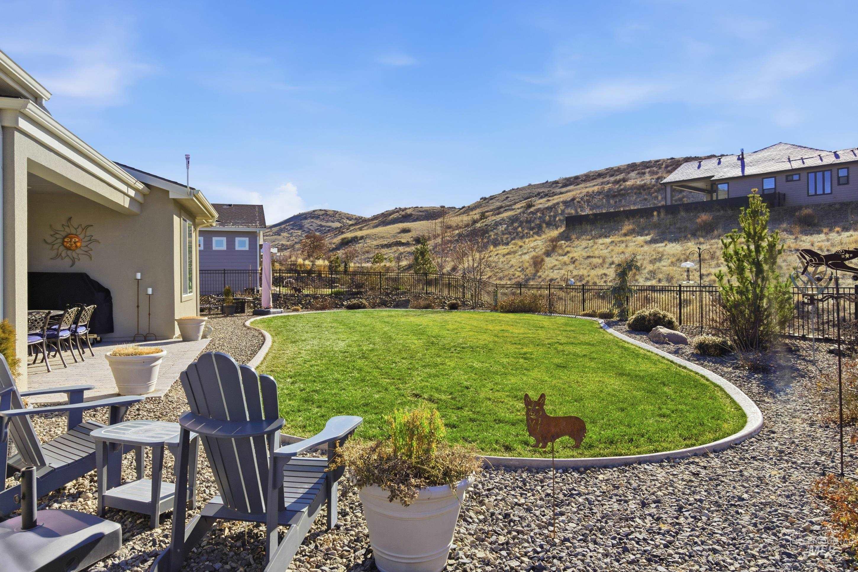 Fenced backyard with a patio and a mountain view