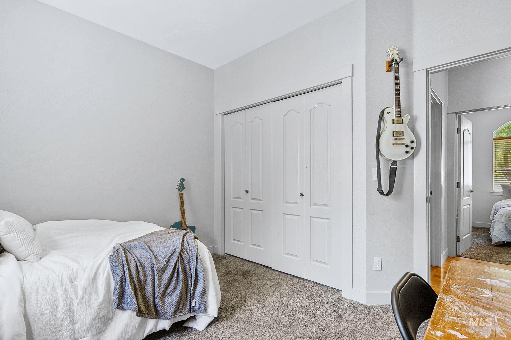 Neutral toned room with grey carpeting and light grey wall paint