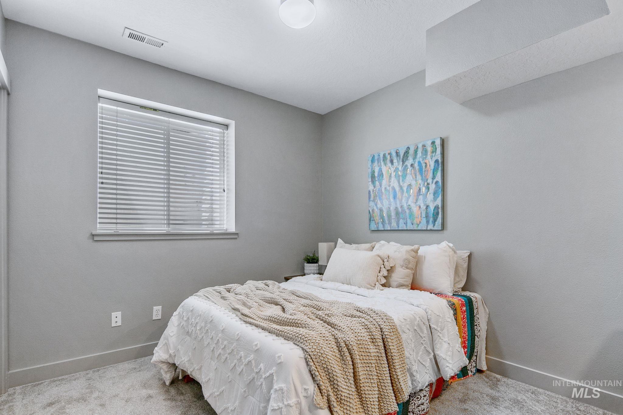 Neutral gray wall paint with white trim