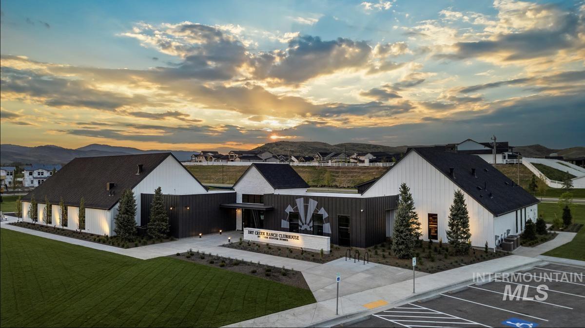 Exterior space with uncovered parking and a mountain view