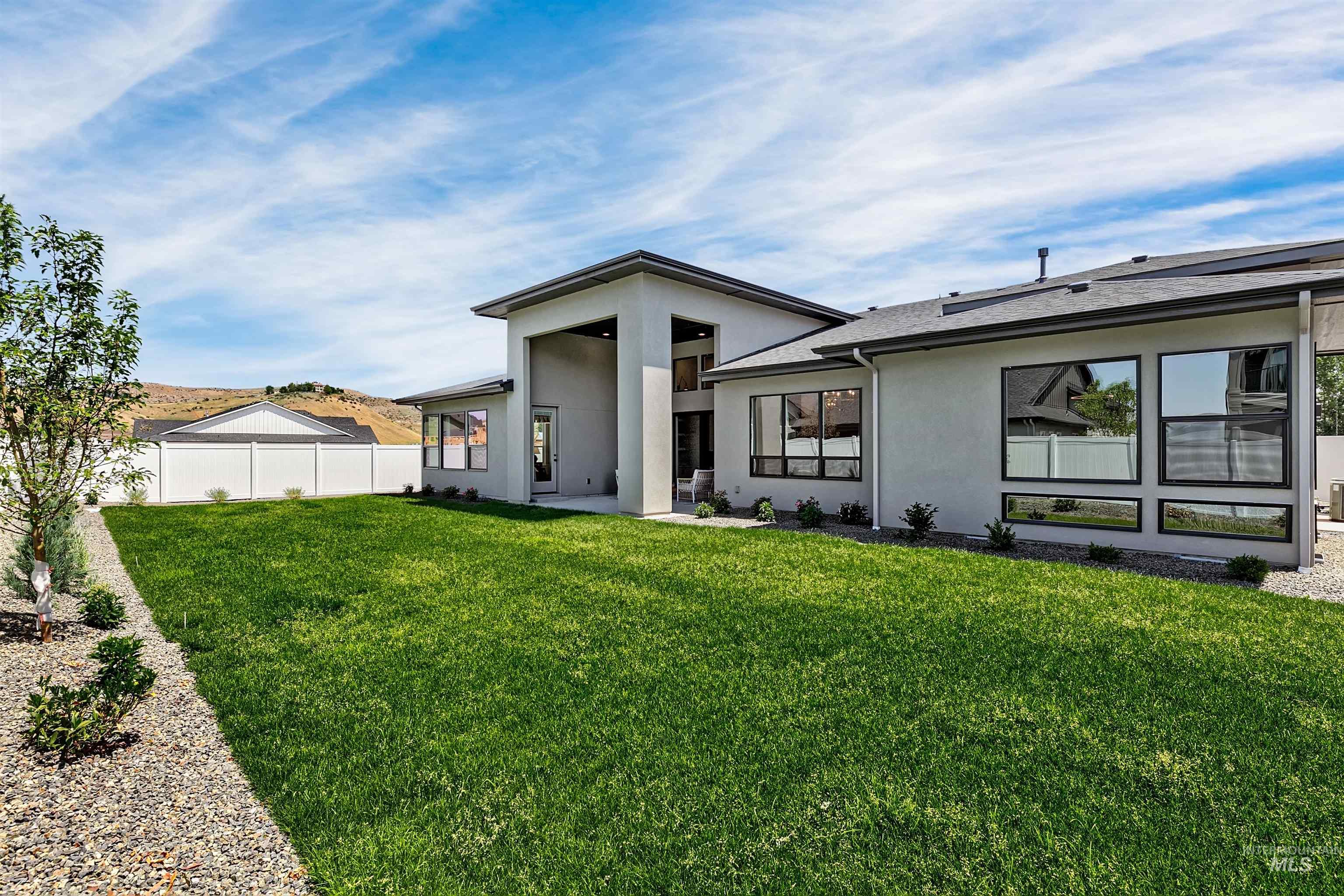 Rear view of house with stucco siding