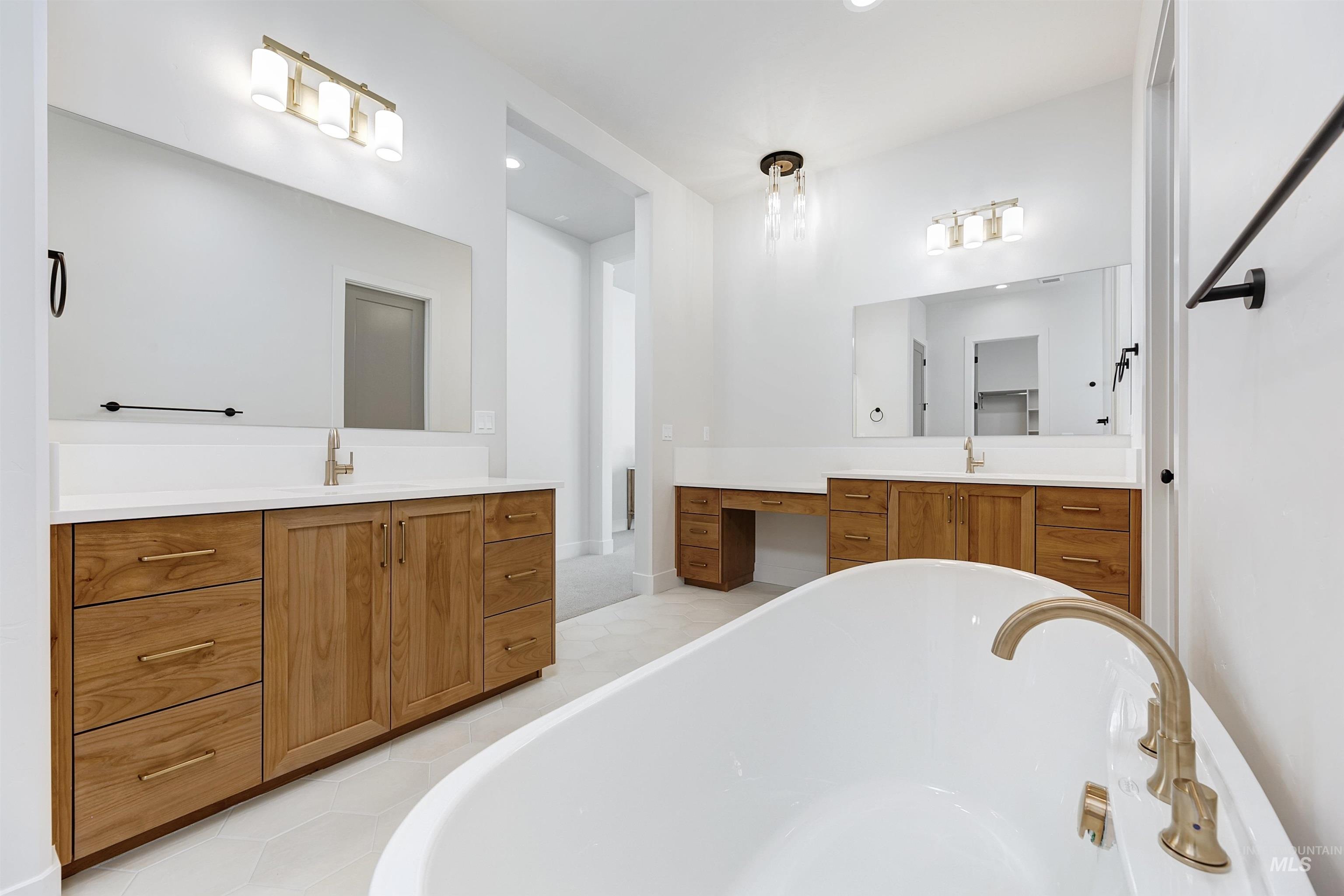 Full bathroom with a freestanding bath and vanity