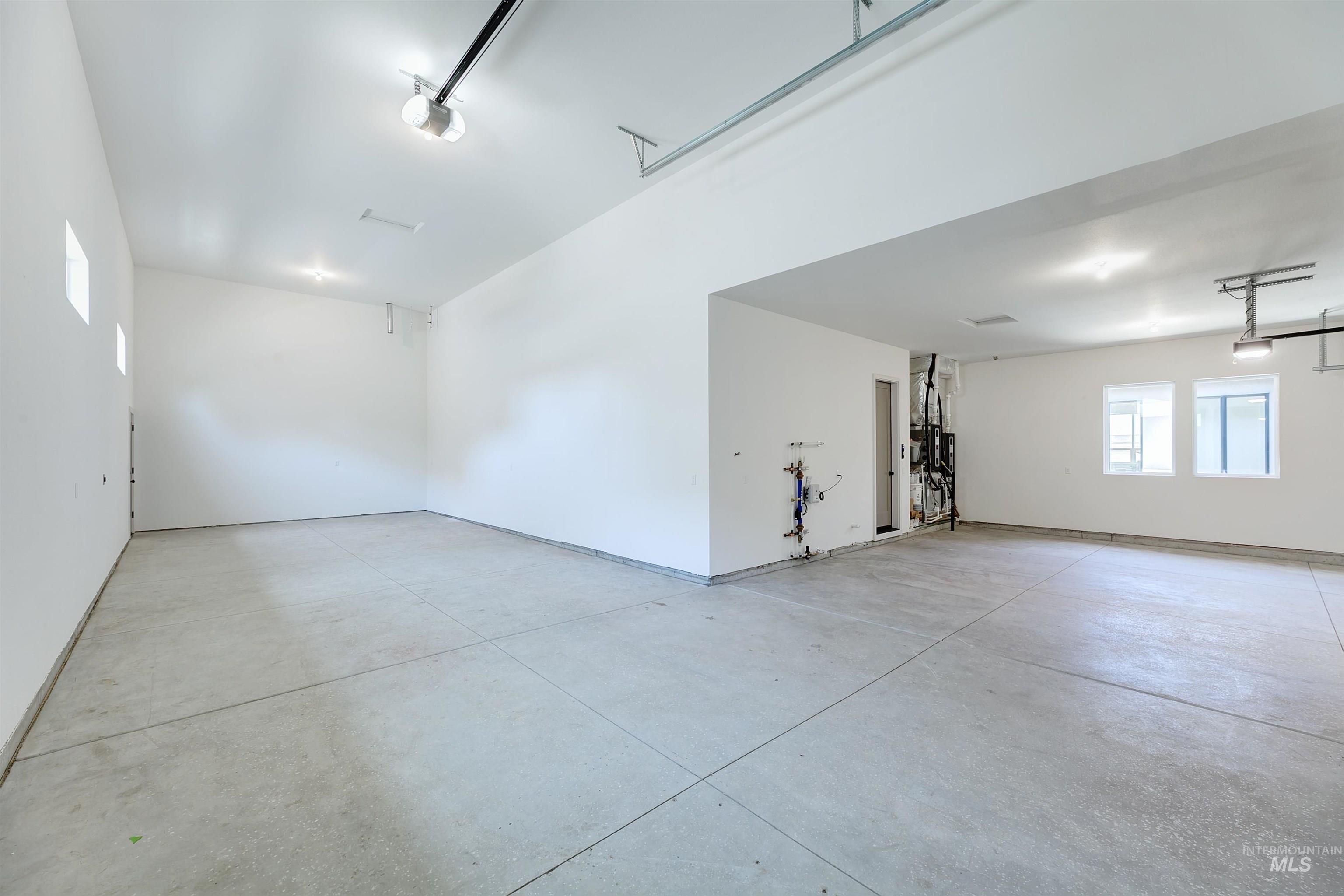 Garage featuring a garage door opener