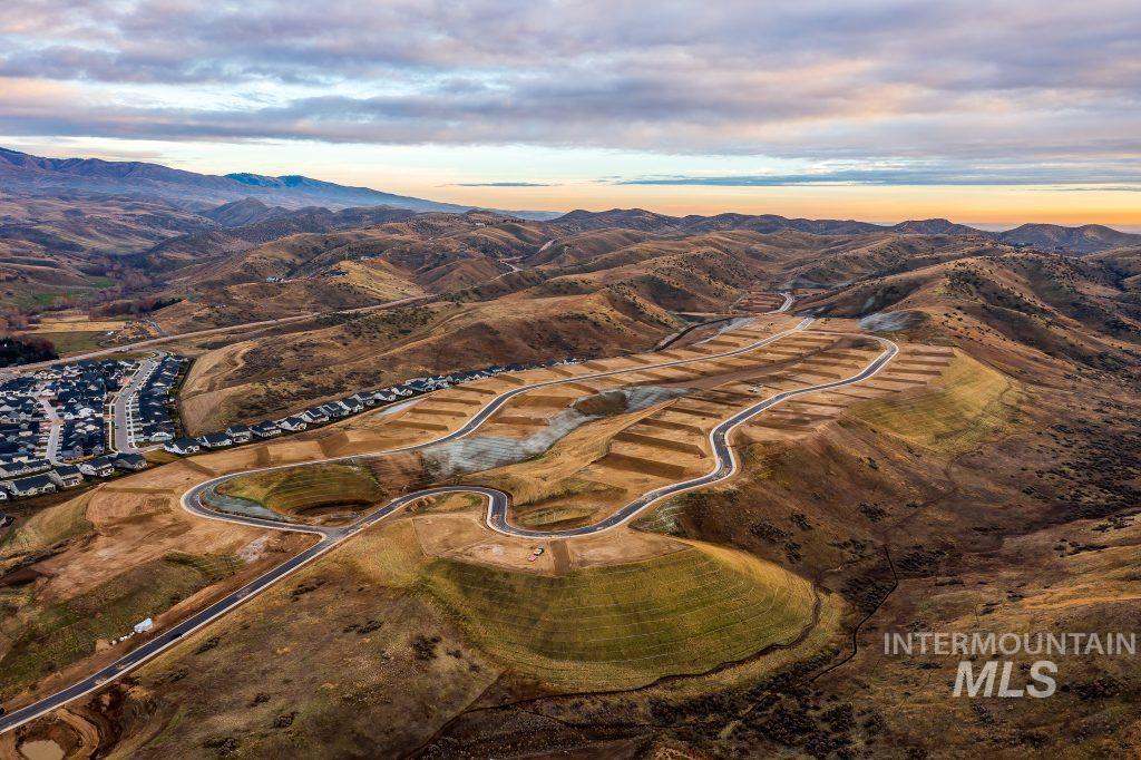 Aerial view of property and surrounding area with mountains