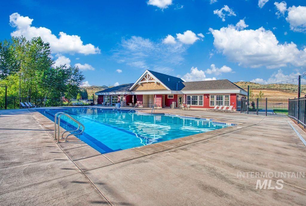 Community pool featuring a patio