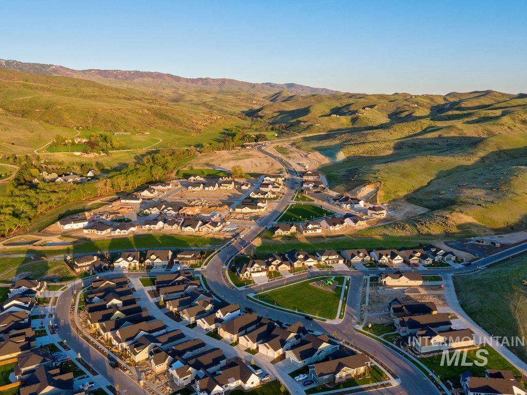 View of property location with mountains and nearby suburban area