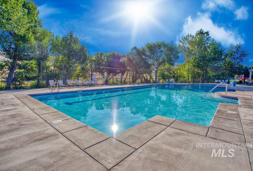 Community pool with a patio