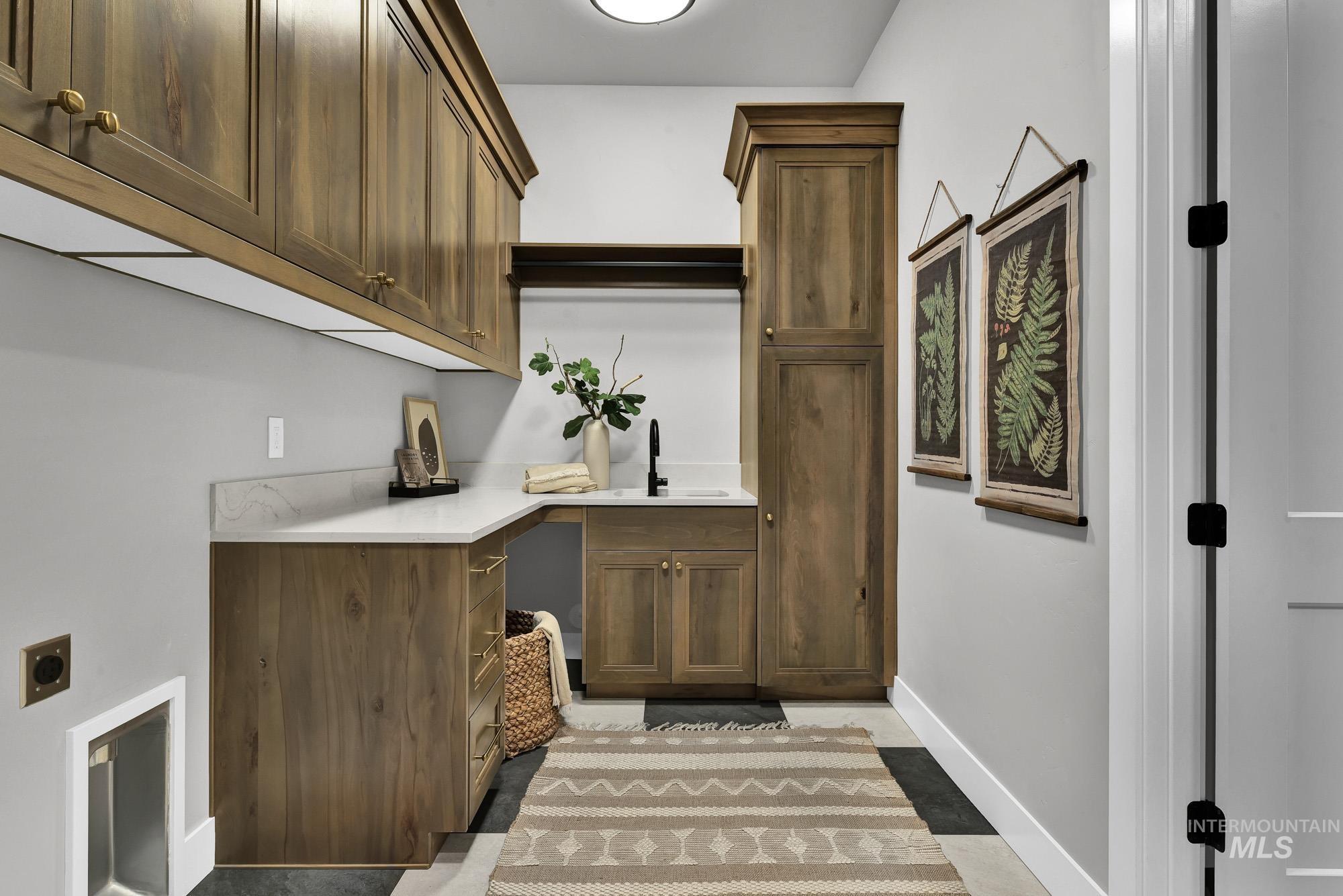 Washroom with cabinet space and electric dryer hookup