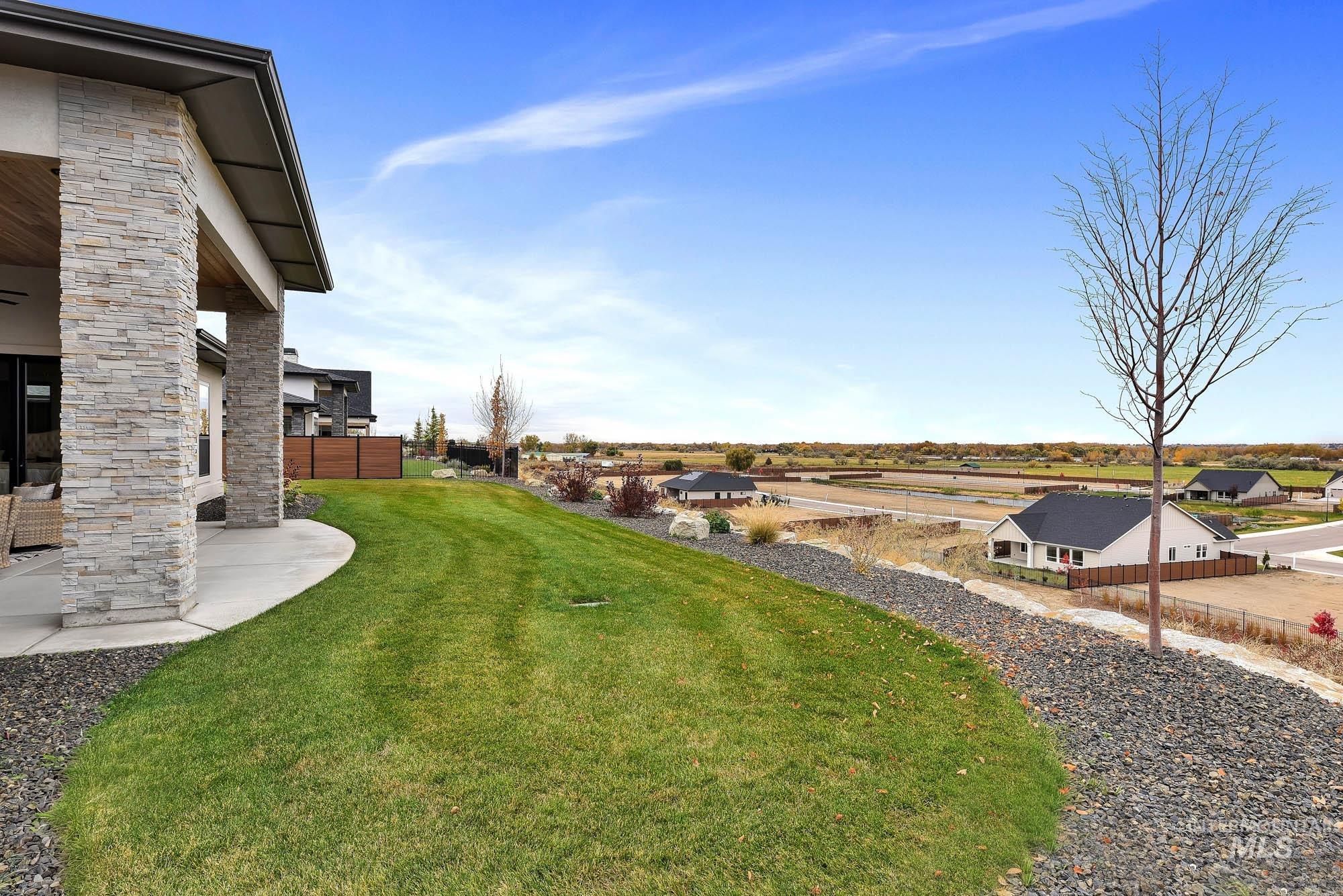 View of yard featuring a residential view and a patio area