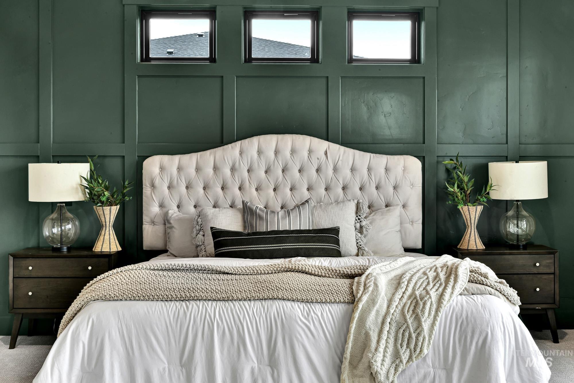 Bedroom with a decorative wall and carpet