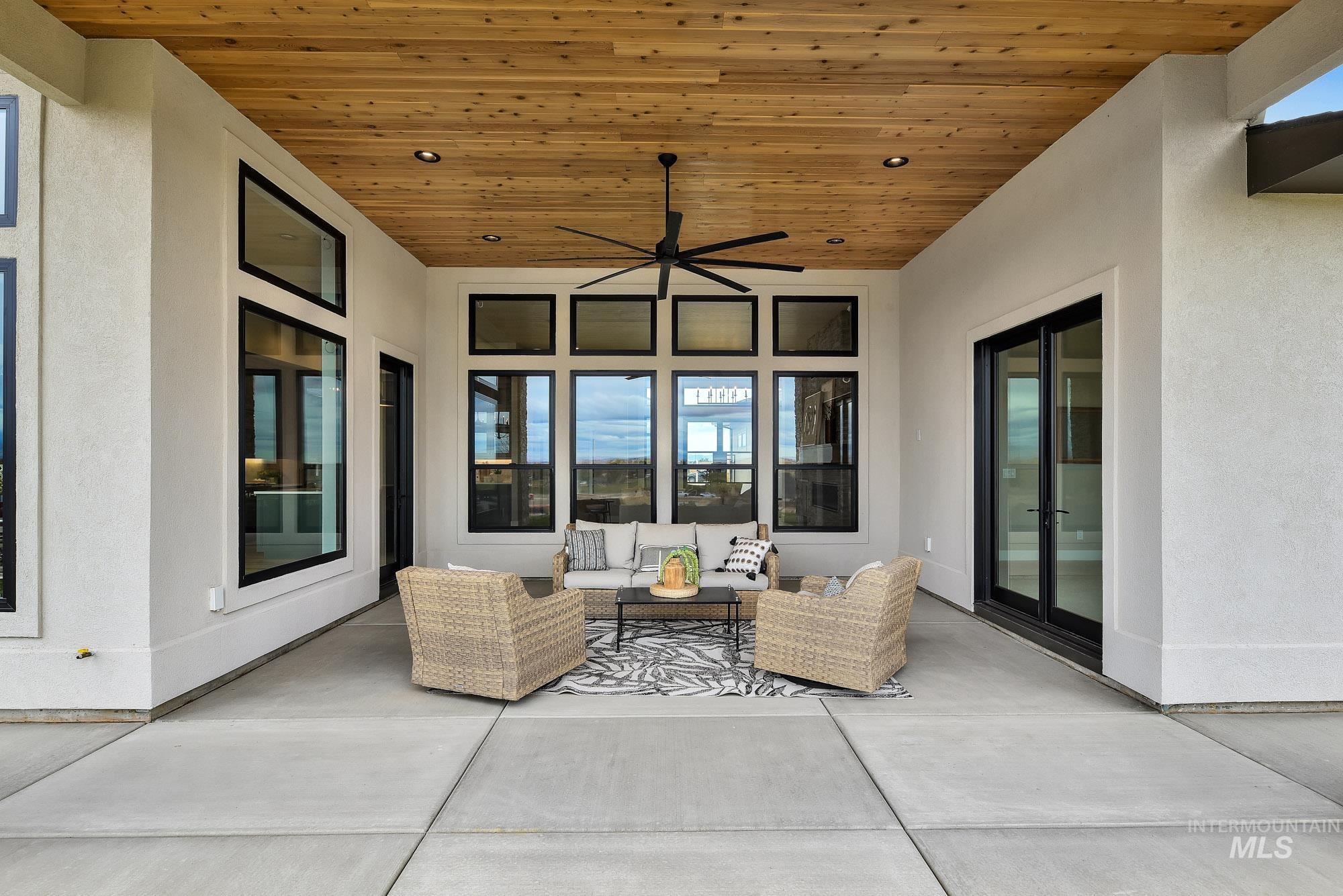 View of patio / terrace with a ceiling fan and outdoor lounge area