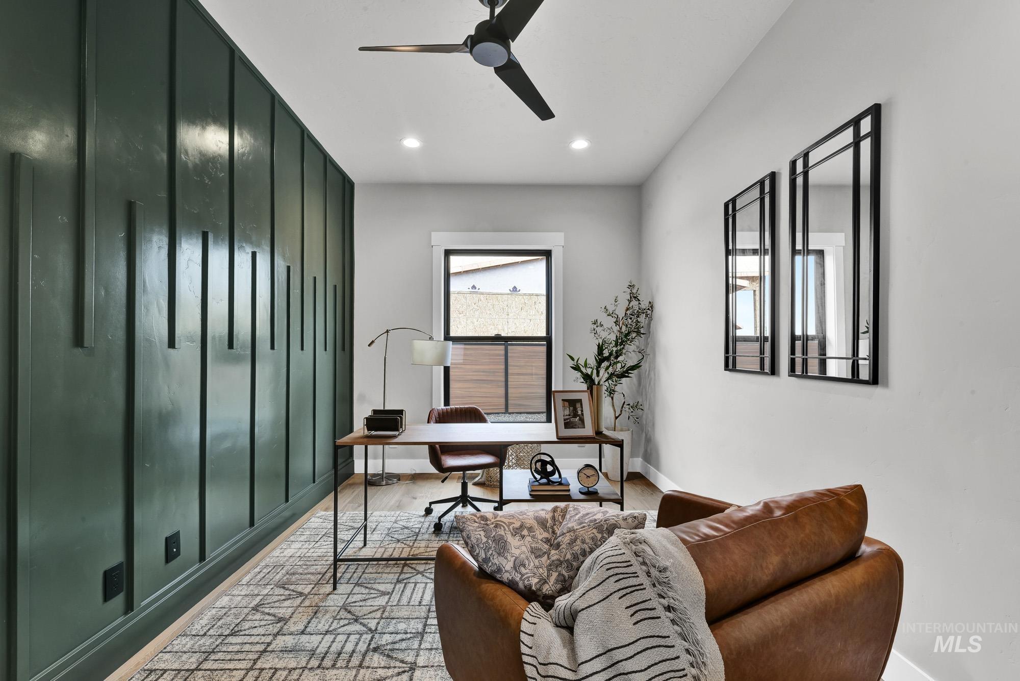 Office space featuring a ceiling fan and recessed lighting