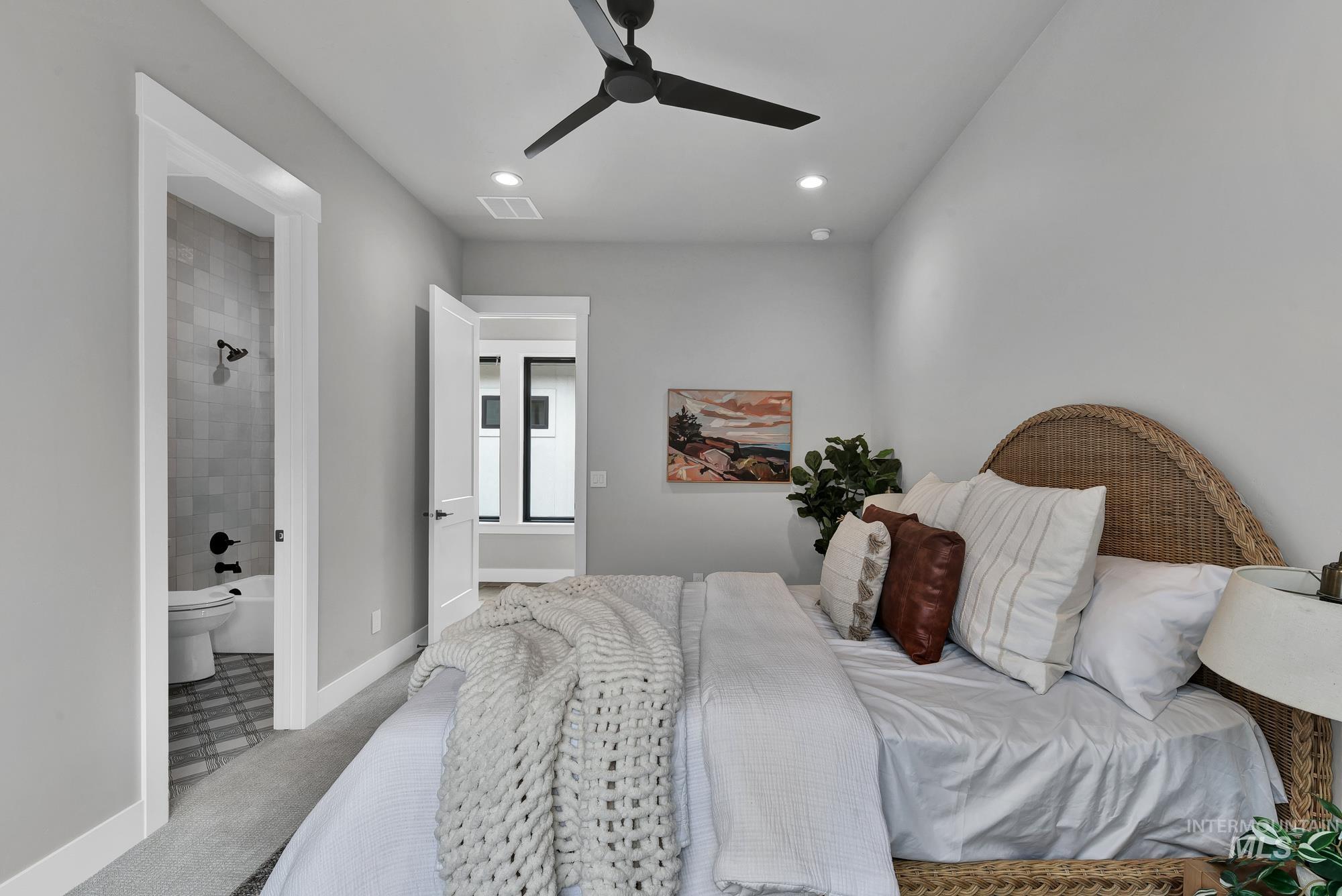 Bedroom with a ceiling fan, recessed lighting, carpet flooring, and ensuite bathroom