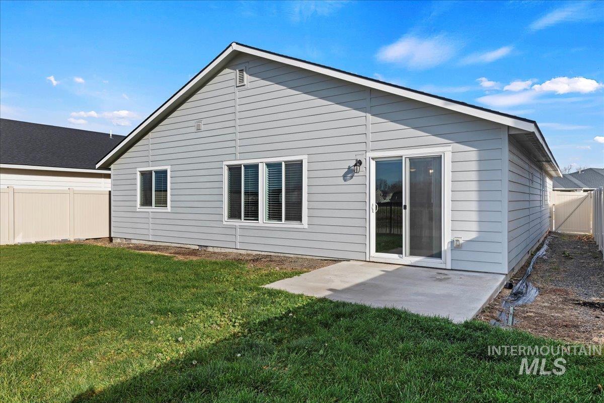 Back of house with a patio area