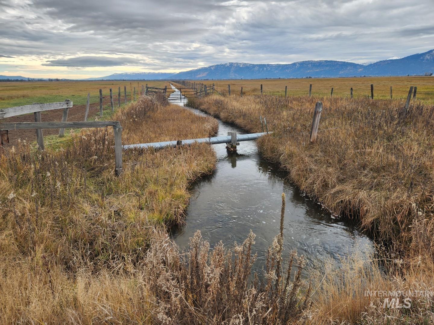 Water view featuring rural landscape and a mountain backdrop