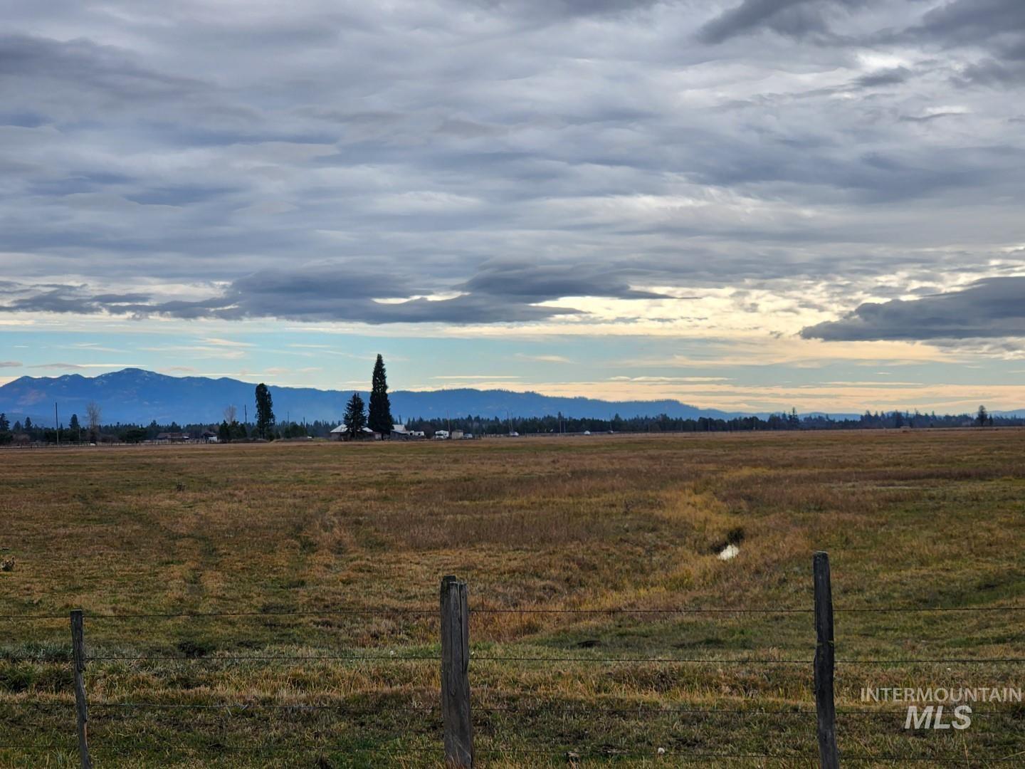 View of mountain backdrop featuring rural landscape