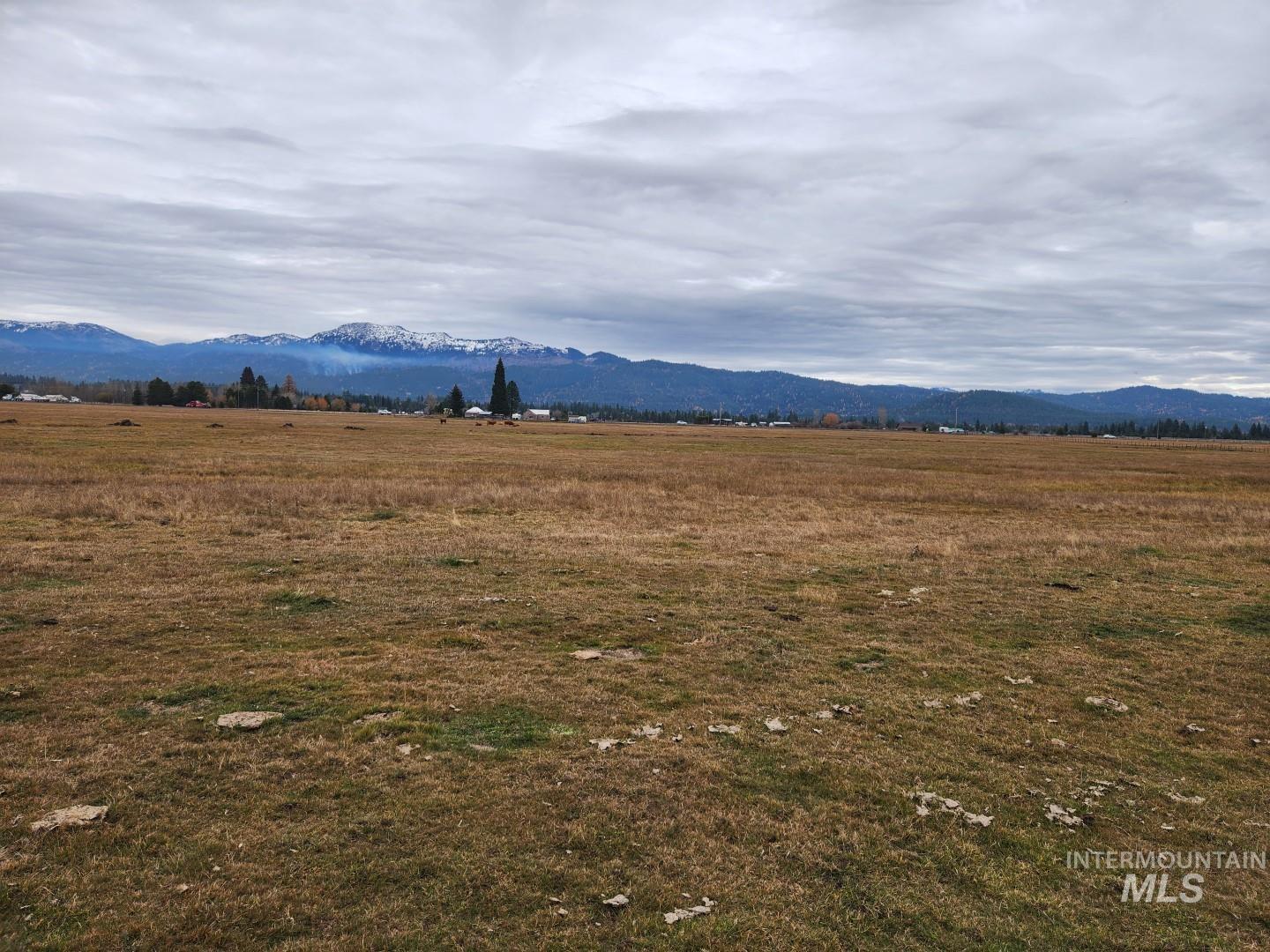 View of mountain background featuring rural landscape