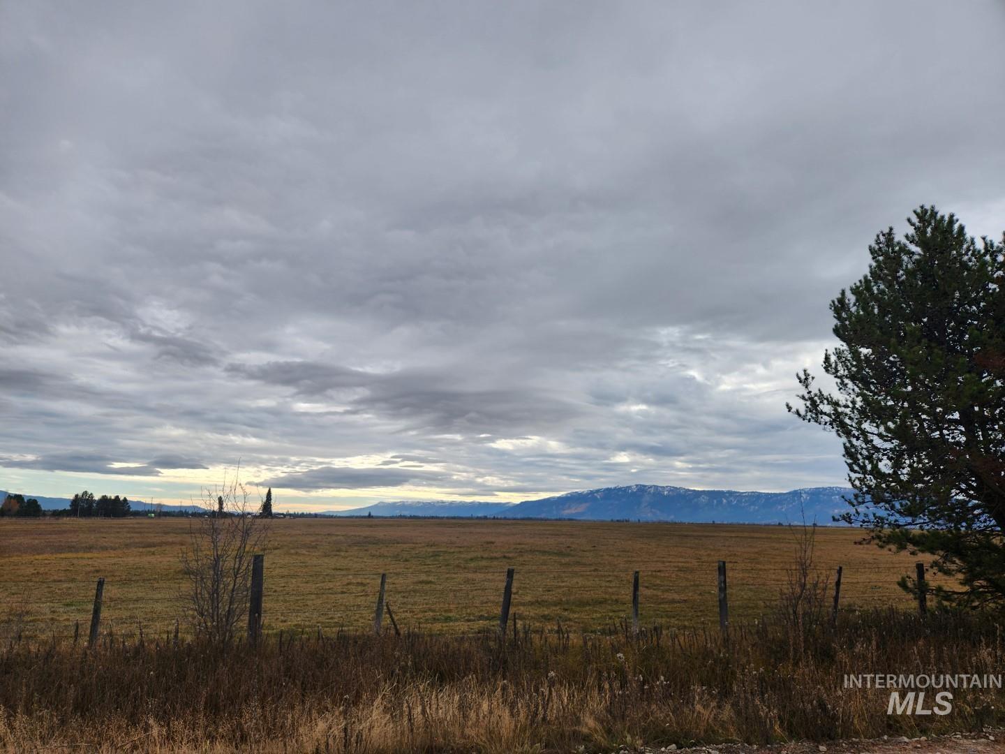 View of mountain backdrop featuring rural landscape