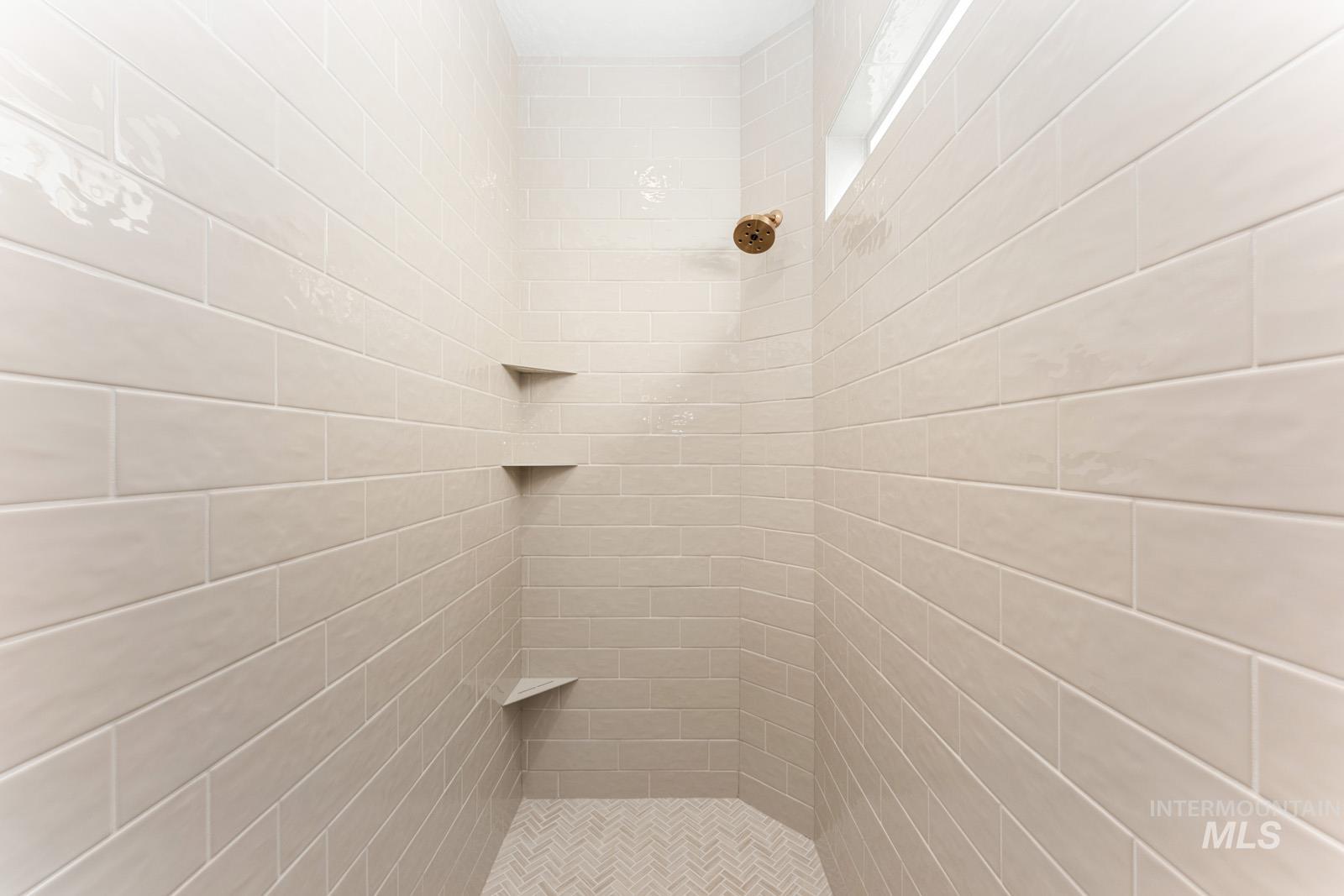 Full bathroom with tiled shower