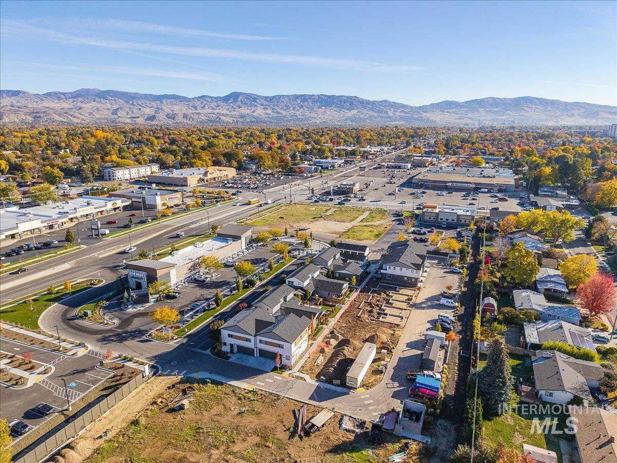 Aerial view of property's location with a mountain backdrop