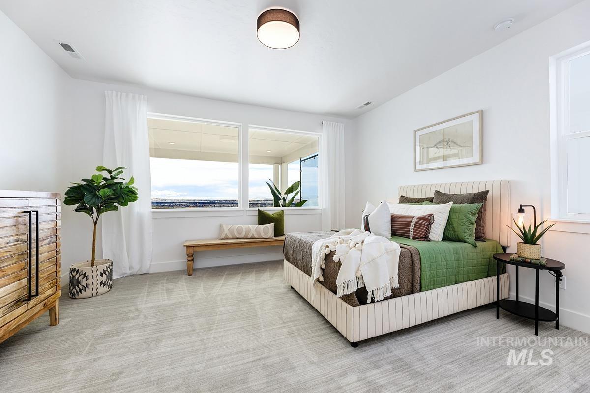 Bedroom with carpet flooring and baseboards