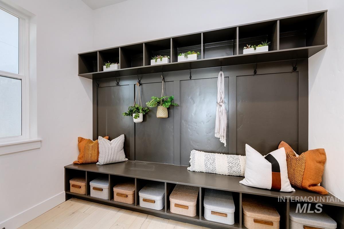 Mudroom with baseboards and light wood-style floors