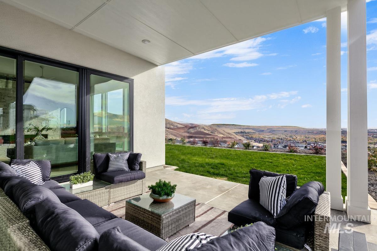View of patio with outdoor lounge area and a mountain view