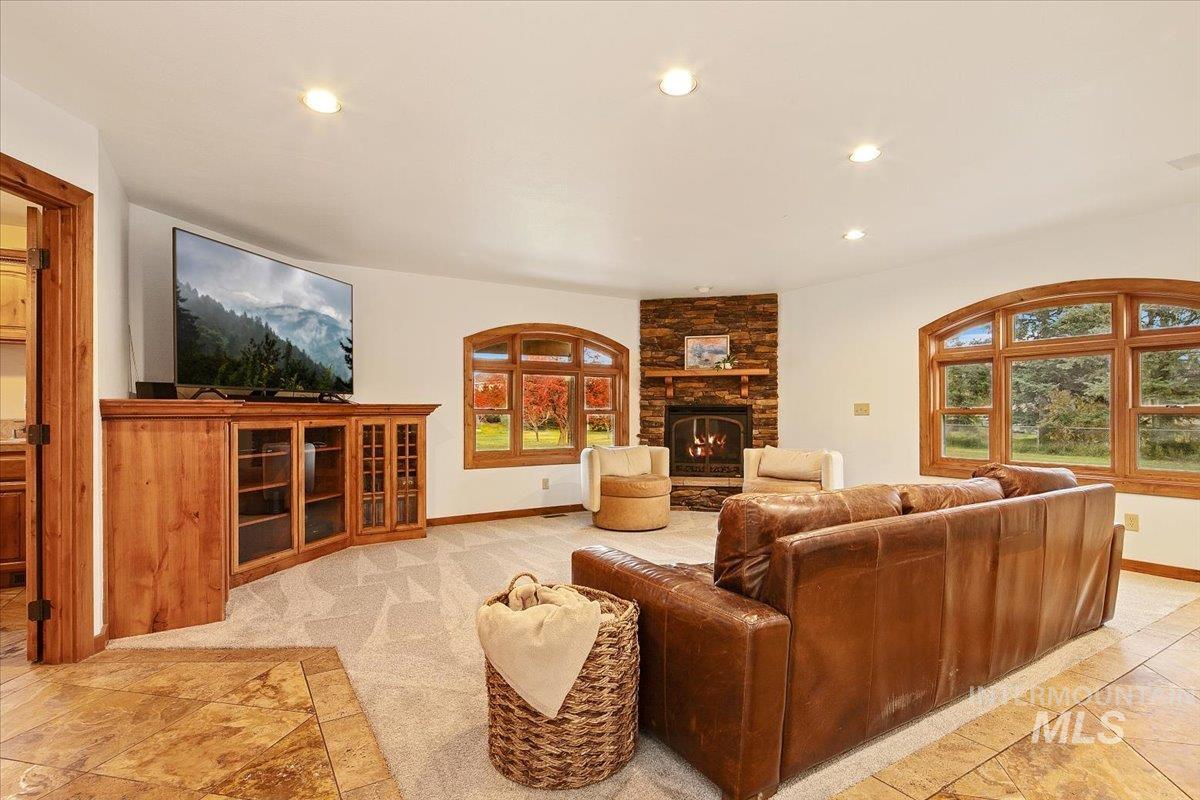 Living room featuring recessed lighting and a fireplace