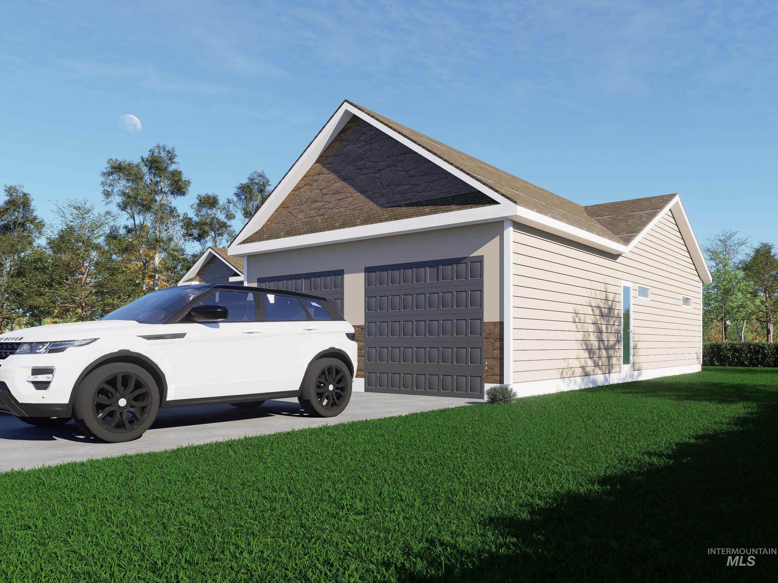 View of side of home with an attached garage, a lawn, and concrete driveway