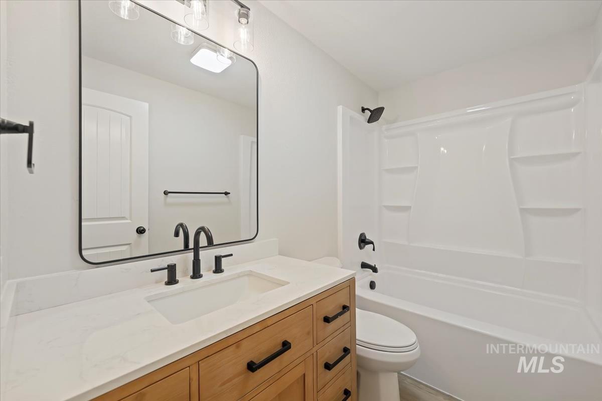 Full bathroom with vanity and tub / shower combination